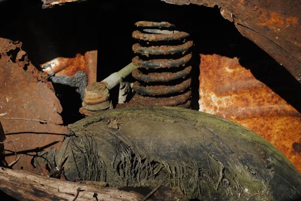 Close-up of a worn shock absorber