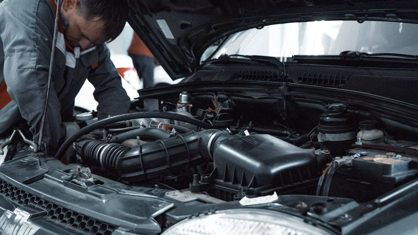 Technician performing complete auto repair in California